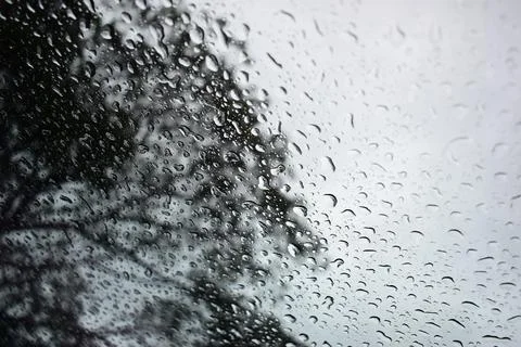 Abstract natural texture of raindrop moisture beads on transparent glass wind Stock Photos