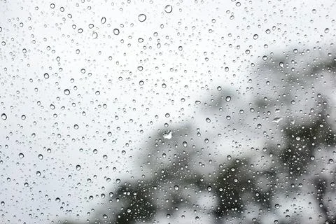 Abstract natural texture of raindrop moisture beads on transparent glass wind Stock Photos