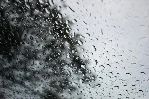 Abstract natural texture of raindrop moisture beads on transparent glass wind Stock Photos