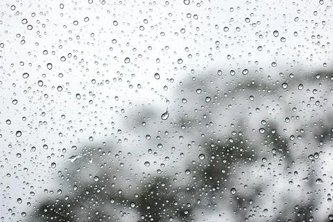 Abstract natural texture of raindrop moisture beads on transparent glass wind Stock Photos