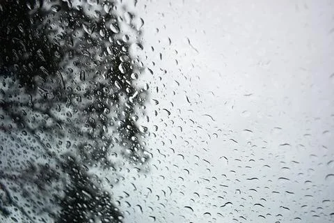 Abstract natural texture of raindrop moisture beads on transparent glass wind Stock Photos