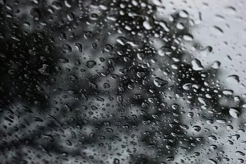 Abstract natural texture of raindrop moisture beads on transparent glass wind Stock Photos