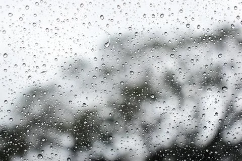 Abstract natural texture of raindrop moisture beads on transparent glass wind Stock Photos