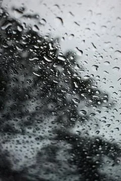 Abstract natural texture of raindrop moisture beads on transparent glass wind Stock Photos