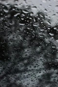 Abstract natural texture of raindrop moisture beads on transparent glass wind Stock Photos