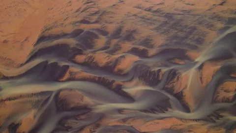 Abstract Natural World River Braids Iceland. Red Sand Blue Rivers Drone Stock Footage 256693325