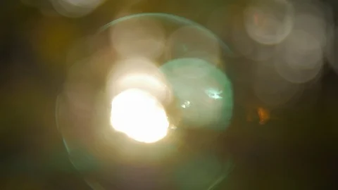 Abstract nature bokeh background. Sunset light, sun lens flares, golden hour Stock Footage 82033025
