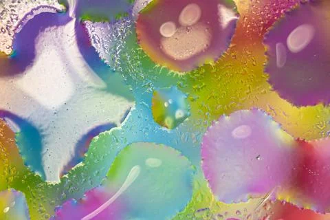 Abstract neon background from multi-colored circles, water drops of different 스톡 사진