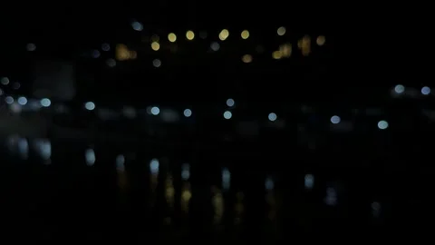 Abstract night scene with blurred lights reflecting on water in a mysteriou.. Stock-Footage 340220436
