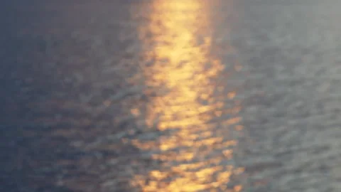 Abstract Ocean Reflections at Sunset with Shimmering Golden Light Patterns Stock Footage 264348370