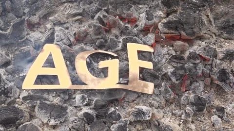 Abstract old age burns in the fire on hot coals. A sign of loss or end. Stock Footage 120381142