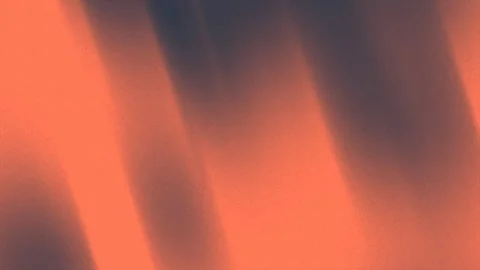 Abstract orange and red gradients with dark blurred shapes Видео 335944157
