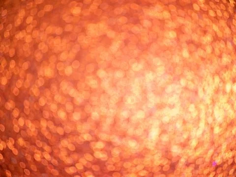 Abstract orange bokeh background with bright circular light spots Stock Photos