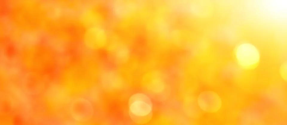 Abstract orange bokeh blurred background Stock Photos