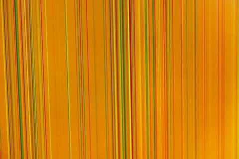 Abstract orange digital screen background displaying vibrant vertical lines.. 스톡 사진