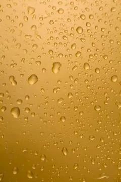 Abstract orange drops of water background Stock Photos