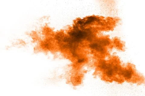 Abstract orange dust explosion on white background. Abstract orange powder .. Stock Photos