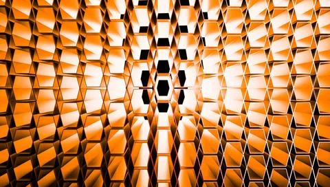Abstract orange geometric wall with a pattern of protruding cube-like shap... Stock Photos