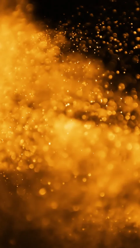 Abstract orange glittering particles in motion on black background. Vertical 動画素材 267063095