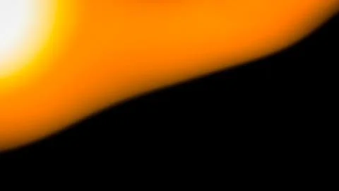 Abstract orange light flare gradient against a solid black background Ilustração Stock