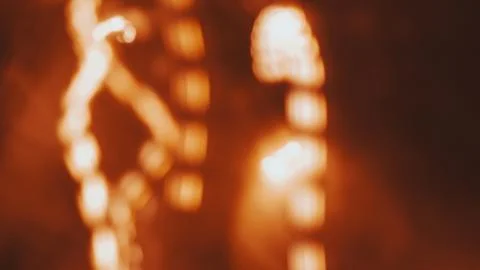 Abstract orange light patterns with blurred background and glowing effects 스톡 사진
