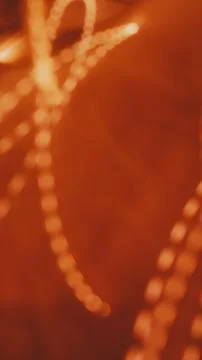 Abstract orange light trails creating dynamic patterns on a blurred backgroun Stock Photos