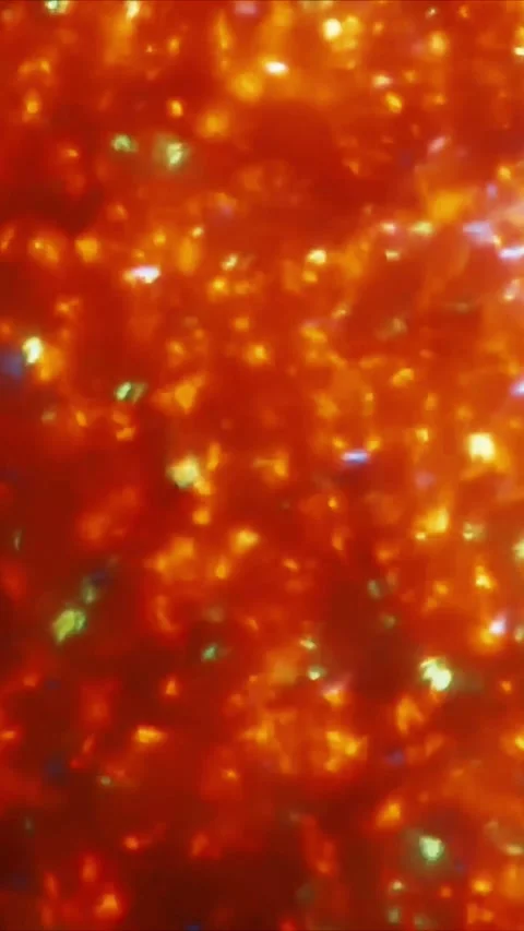 Abstract orange liquid surface with shimmering golden light reflections and Stock-Footage 347692013