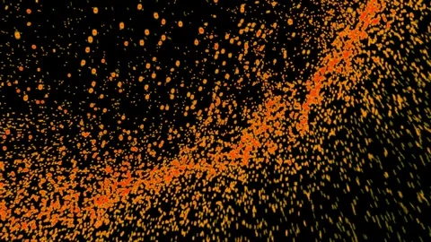 Abstract orange particles stream across dark background in motion Stock Footage 327625028