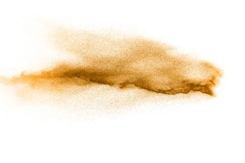Abstract orange powder explosion on white background. Freeze motion of orange Stock Photos