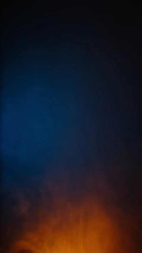 Abstract orange smoke flame pulsating on dark blue background creating cosmic Stock Footage 313933413