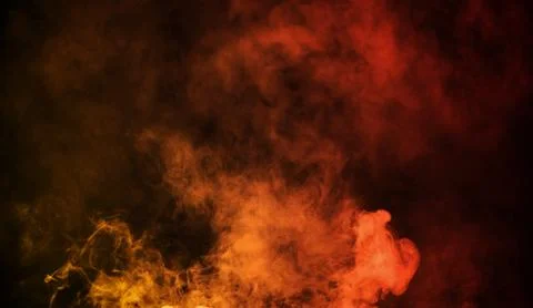Abstract orange vs red smoke steam moves on a black background . The concept  Illustrazione stock