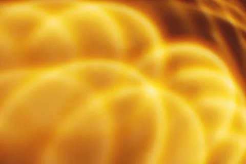 Abstract orange wavy ligt pattern or background Stock Photos