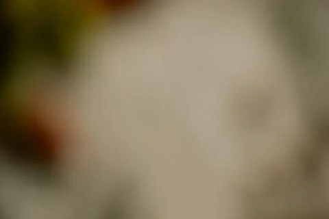 Abstract out of focus background with warm beige light and soft grain Stock Photos