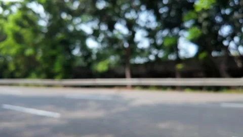Abstract Out Of Focus Blur Of Empty Asphalt Road And Green Trees Video stock 339183518
