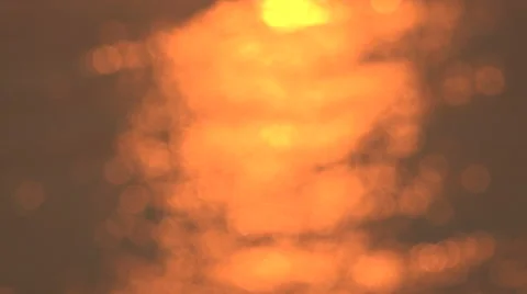 Abstract, out of focus golden reflection from sun, ripples in water Stock Footage 50022885