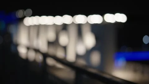 An abstract out-of-focus night scene showing bright white bokeh circles and e Stock Footage 345019822