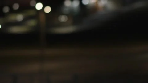 An abstract out-of-focus night scene showing soft bokeh lights from streetlam Stock Footage 345020040