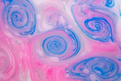 Abstract paint ink, psychedelic background. Colorful spots on water surface. Stock Photos