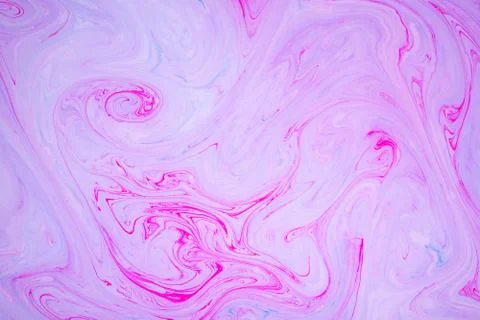 Abstract paint ink, psychedelic background. Colorful spots on water surface. Stock Photos