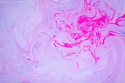 Abstract paint ink, psychedelic background. Colorful spots on water surface. Stock Photos