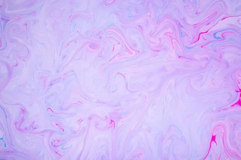 Abstract paint ink, psychedelic background. Colorful spots on water surface. Stock Photos
