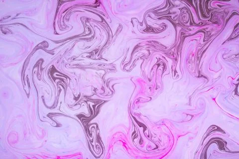 Abstract paint ink, psychedelic background. Colorful spots on water surface. Stock Photos