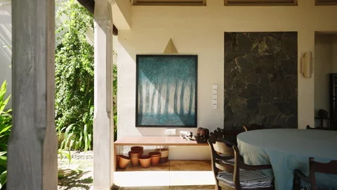 Abstract painting with blue trees in leaving room of retro villa on tropical Stock Footage 249820060