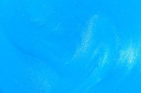 Abstract Pale blue fluid background with small pearlescent glowing particles. Foto stock