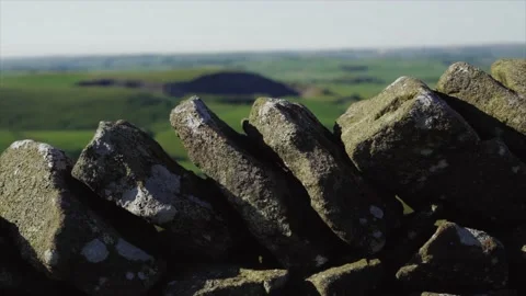 Abstract panning shot of an old stone wall in the UK 動画素材 131108592