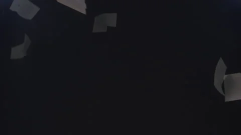 Abstract Papers Fall Through the Darkness in Slow Motion Stock Footage 210220949