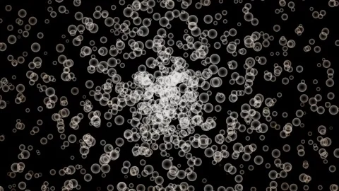 Abstract particle explosion expanding with gentle bokeh glow in dark cinema.. Stock Footage 340942602