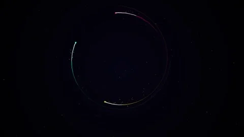 Abstract particle light trails spinning in spiral orbits over a dark starry.. 스톡 동영상 343658703