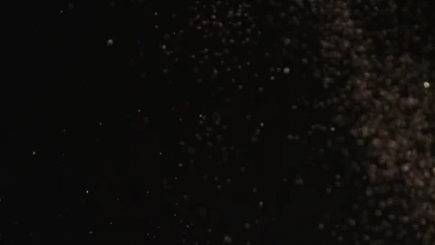 Abstract particle motion on dark gradient background. Dynamic flowing dots and l Stock Footage 340456486