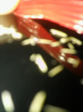 Abstract particles in black background with different elements in blurry effe Stock Photos